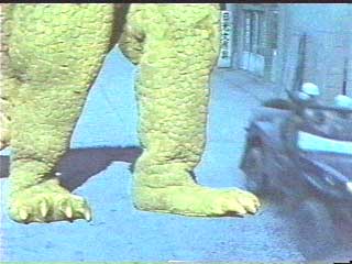Bright green monster legs betray tiny budget.